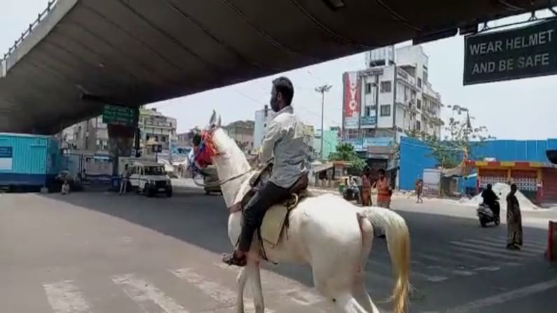 A youth rides horse to attend marriage party in kr market bangalore amid tight covid curfew guidelines 3