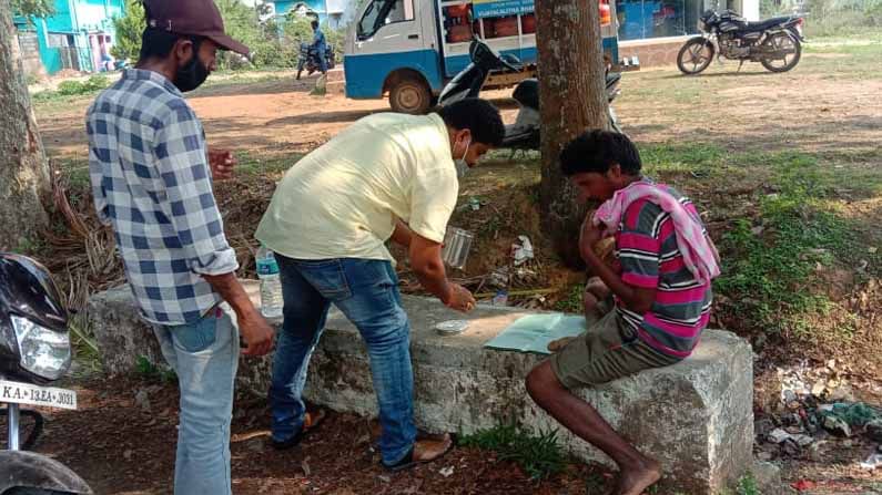 man search food in garbage  