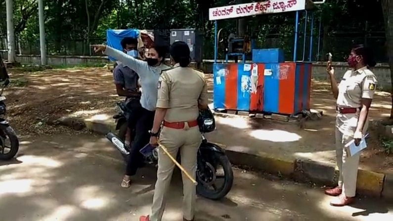 woman riding bike with dog breaking covid guidelines make kirik with police in m