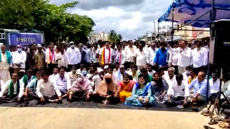 demanding national highway 234 repair localities at manchenahalli sit protest against health minister dr k sudhakar