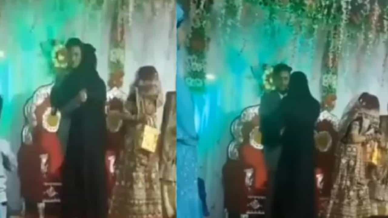 Viral Video: ಮದುವೆಯಲ್ಲಿ ವರನನ್ನು ಪದೇಪದೆ ತಬ್ಬಿಕೊಂಡ ಬುರ್ಖಾಧಾರಿ ಮಹಿಳೆ; ಅಸಲಿ ವಿಚಾರ ತಿಳಿದು ಶಾಕ್ ಆದ ವಧು! Viral Video: ಮದುವೆಯಲ್ಲಿ ವರನನ್ನು ಪದೇಪದೆ ತಬ್ಬಿಕೊಂಡ ಬುರ್ಖಾಧಾರಿ ಮಹಿಳೆ; ಅಸಲಿ ವಿಚಾರ ತಿಳಿದು ಶಾಕ್ ಆದ ವಧು!