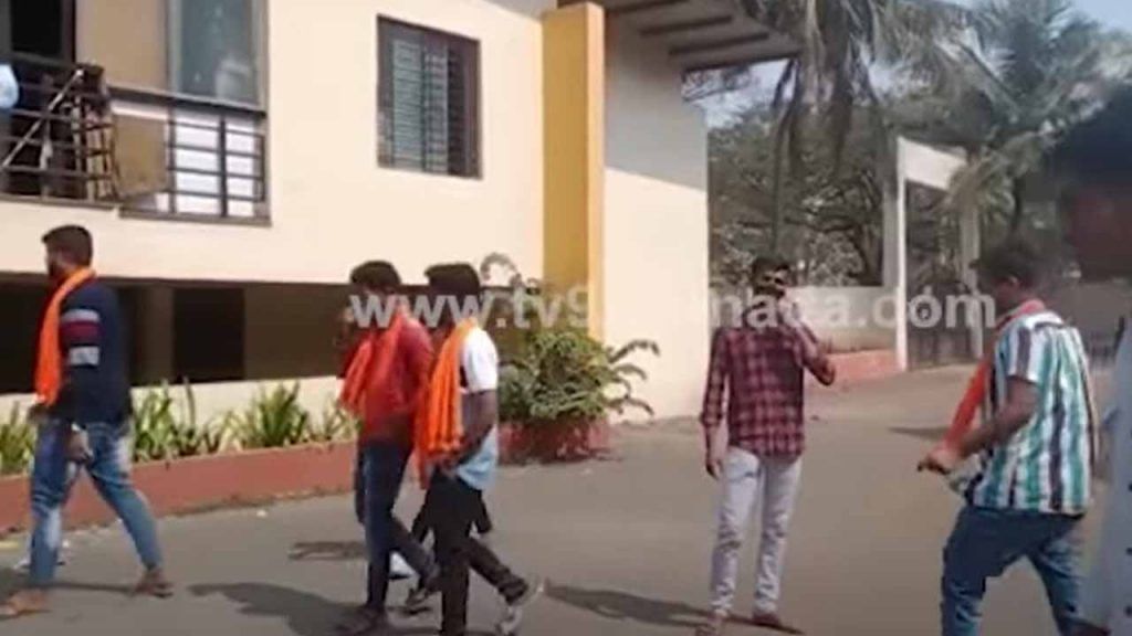 Youth with kesari shawl in college premises