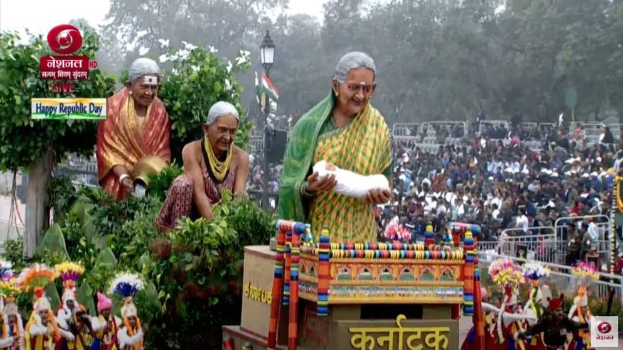 ಟ್ಯಾಬ್ಲೊ ಮುಂಭಾಗದಲ್ಲಿ ಎರಡು ಸಾವಿರಕ್ಕೂ ಅಧಿಕ ಹೆರಿಗೆ ಮಾಡಿಸಿರುವ ತುಮಕೂರಿನ‌ ಪಾವಗಡದ ಸೂಲಗಿತ್ತಿ ನರಸಮ್ಮ ಅವರ ಚಿತ್ರವನ್ನು ಮಧ್ಯಭಾಗದಲ್ಲಿ 30 ಸಾವಿರಕ್ಕೂ ಅಧಿಕ ಔಷಧಿಯ ಸಸಿಗಳನ್ನು ಪೊಷಿಸಿದ ಹಾಲಕ್ಕಿ ತುಳಸಿಗೌಡ ಹಾಗೂ ಕೊನೆಗೆ ಸಾವಿರಾರು ಮರಗಳನ್ನು ಬೆಳೆಸಿದ ಸಾಲುಮರದ ತಿಮ್ಮಕ್ಕ ಅವರ ಚಿತ್ರವನ್ನು ಬಳಸಿದ್ದು ಅವರ ಸಾಧನೆಗಳನ್ನು ತಿಳಿಸುವ ಪ್ರಯತ್ನ ಮಾಡಲಾಗಿದೆ.