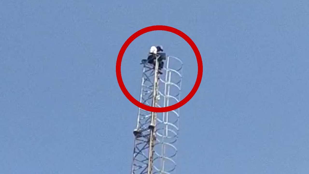 man climbs mobile tower (1)