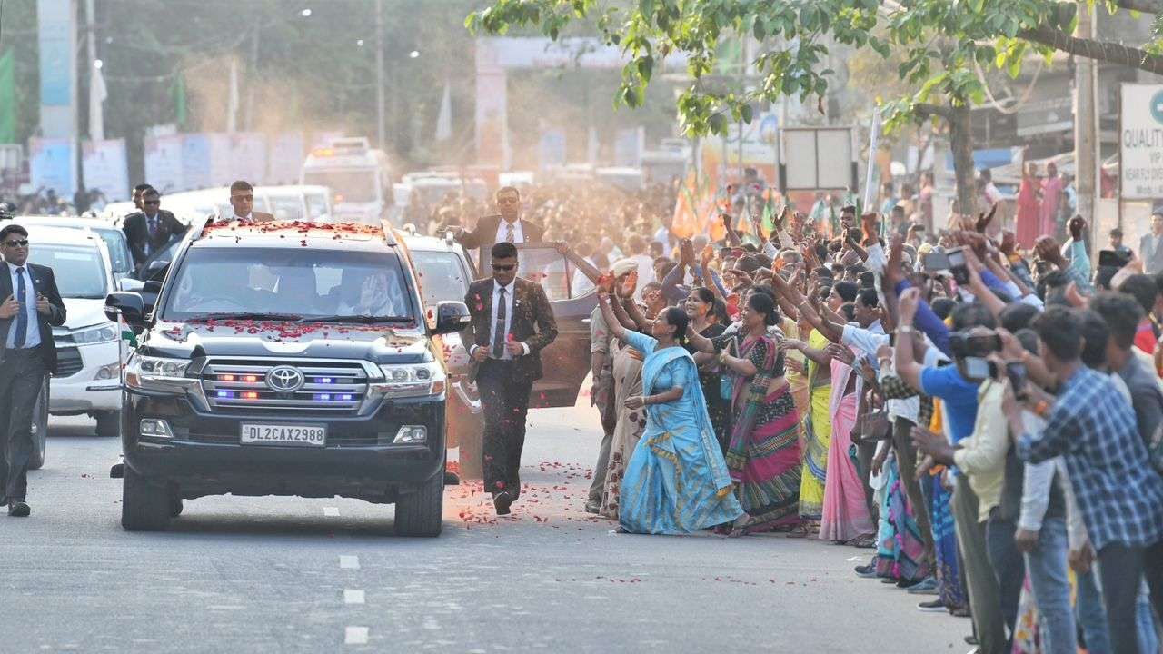Assam PM Modi receive a grand welcome at Guwahati Modi road show photos 
