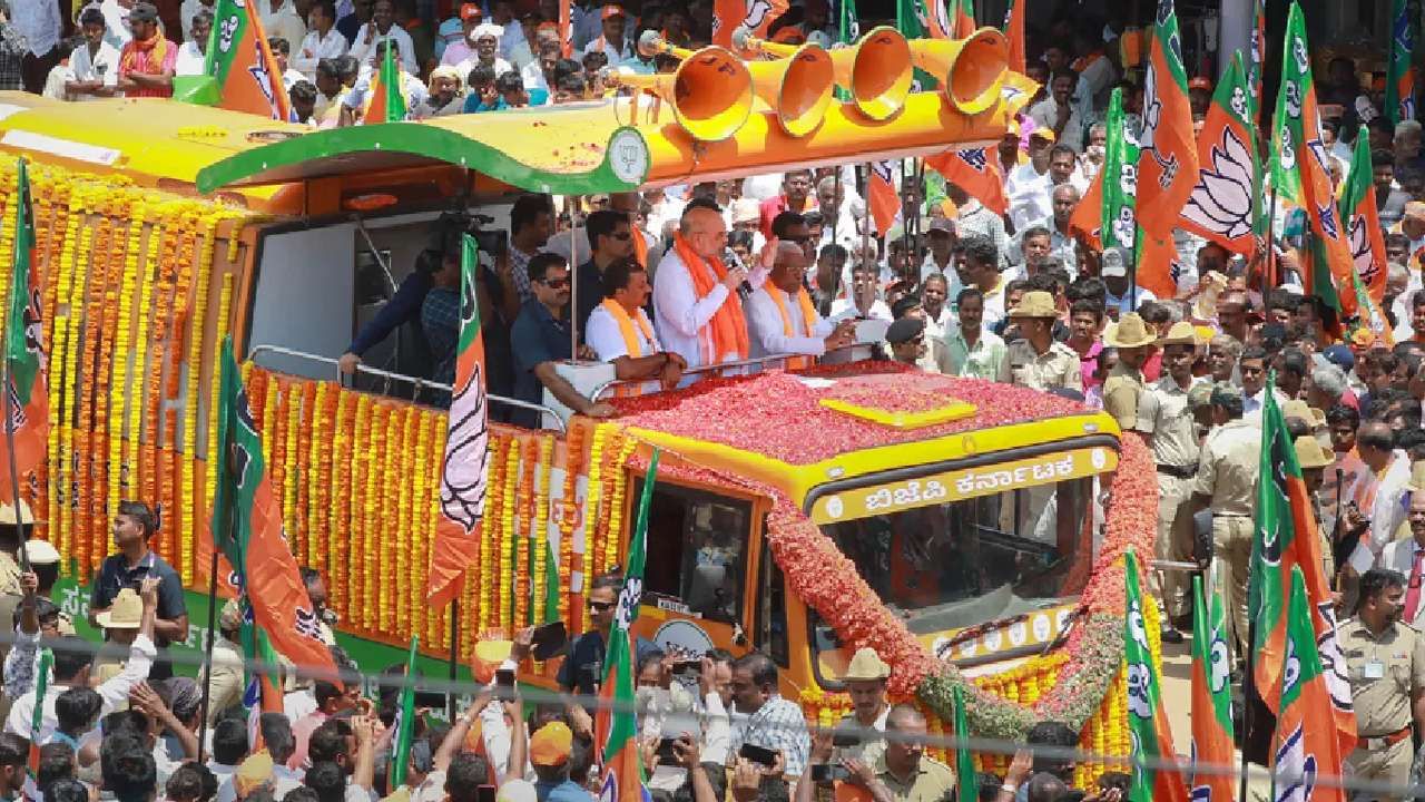 Amit Shah Road Show in Shivamogga Eshwarappa and Yediyurappa make big contributions to state BJP says Amit Shah in Shimoga
