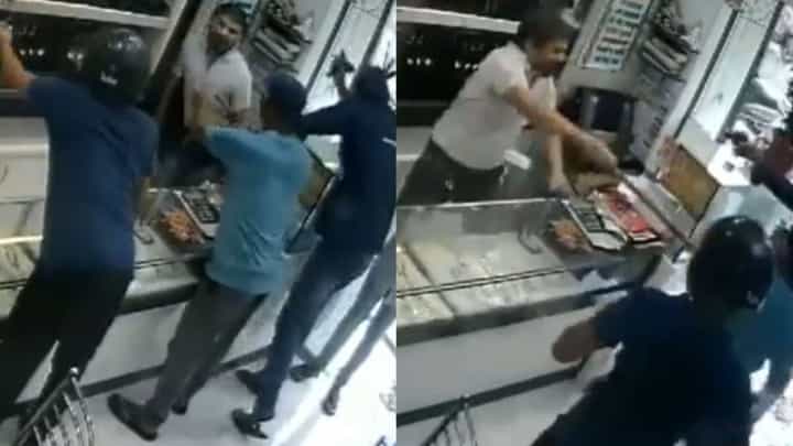 Video: ಪಿಸ್ತೂಲ್, ಚಾಕು ಹಿಡಿದು ಚಿನ್ನ ಕದಿಯಲು ಬಂದ ನಾಲ್ವರನ್ನು ಕೋಲಿನಿಂದ ಹೊಡೆದು ಓಡಿಸಿದ ಮಾಲೀಕ Video: ಪಿಸ್ತೂಲ್, ಚಾಕು ಹಿಡಿದು ಚಿನ್ನ ಕದಿಯಲು ಬಂದ ನಾಲ್ವರನ್ನು ಕೋಲಿನಿಂದ ಹೊಡೆದು ಓಡಿಸಿದ ಮಾಲೀಕ