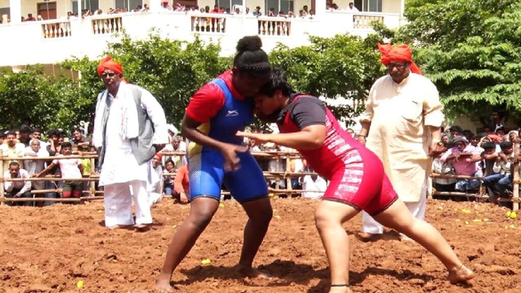 Desi wrestlers perform in the arena of Kotenadu Chitradurga