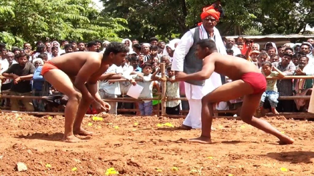 Desi wrestlers perform in the arena of Kotenadu Chitradurga