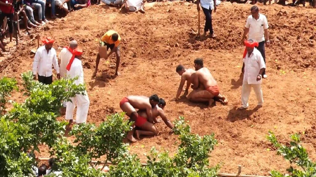 Desi wrestlers perform in the arena of Kotenadu Chitradurga