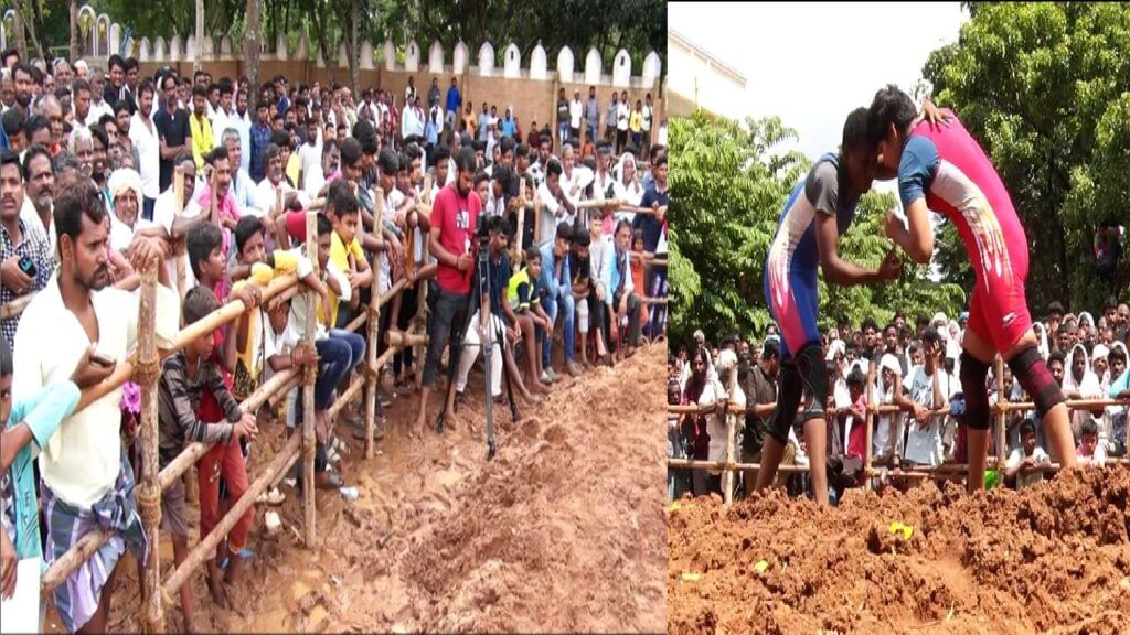 Desi wrestlers perform in the arena of Kotenadu Chitradurga