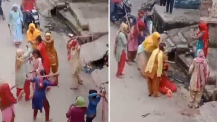 ನಡುರಸ್ತೆಯಲ್ಲೇ ಕೋಲು ಹಿಡಿದು ಮಹಿಳೆಯರ ಹೊಡೆದಾಟ; ಸುತ್ತಲಿನ ಜನ ಕಂಗಾಲು ನಡುರಸ್ತೆಯಲ್ಲೇ ಕೋಲು ಹಿಡಿದು ಮಹಿಳೆಯರ ಹೊಡೆದಾಟ; ಸುತ್ತಲಿನ ಜನ ಕಂಗಾಲು