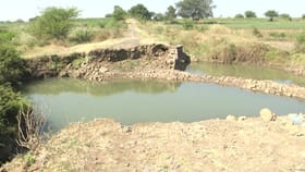 ಕೊಚ್ಚಿಹೋದ ಸೇತುವೆ: 2 ಕಿ.ಮೀ ದೂರದ ಜಮೀನಿಗೆ 20 ಕಿ.ಮೀ ಸುತ್ತಾಟ