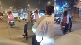 ಬೈಕ್ ಓಡಿಸುತ್ತಿರುವಾಗಲೇ ಪತ್ನಿ ಕೈಯಲ್ಲಿ ಒದೆ ತಿಂದ ಪತಿ