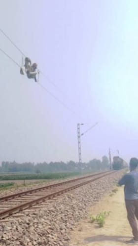 ವಿದ್ಯುತ್ ತಂತಿ ಮೇಲೆ ಕುಳಿತು ವ್ಯಕ್ತಿಯ ಅಪಾಯಕಾರಿ ಸಾಹಸ