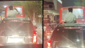 ಹೈವೇಯಲ್ಲೇ ಕಾರಿನ ರೂಫ್ ಟಾಪ್ ಓಪನ್ ಮಾಡಿ ಬಾಟಲಿ ಎತ್ತಿದ ವ್ಯಕ್ತಿ