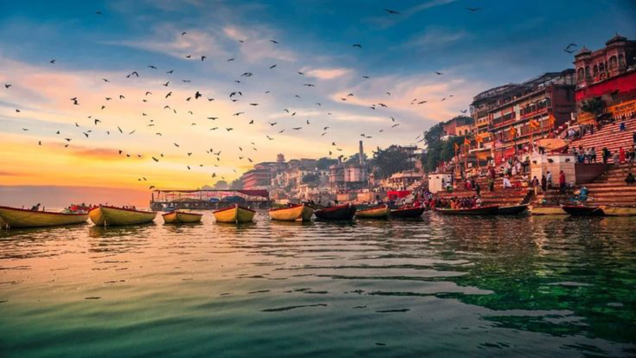 Devotees performing rituals and bathing in the holy Ganges river in Varanasi, Kashi.