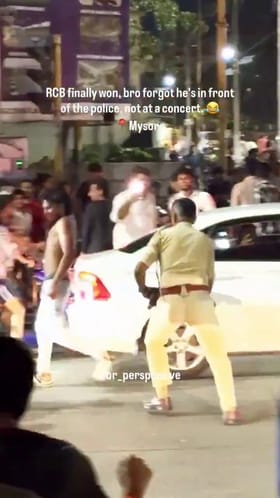 ಪೊಲೀಸ್ ಎದುರೇ ಅಂಗಿಬಿಚ್ಚಿ ಕುಣಿದ RCB ಅಭಿಮಾನಿ! ಬಿತ್ತು ಲಾಠಿ ಏಟು